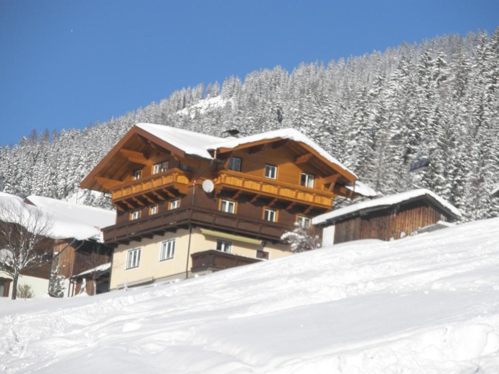 a ski lodge in the snow on a mountain at Vorderstuhlhof in Kleinarl