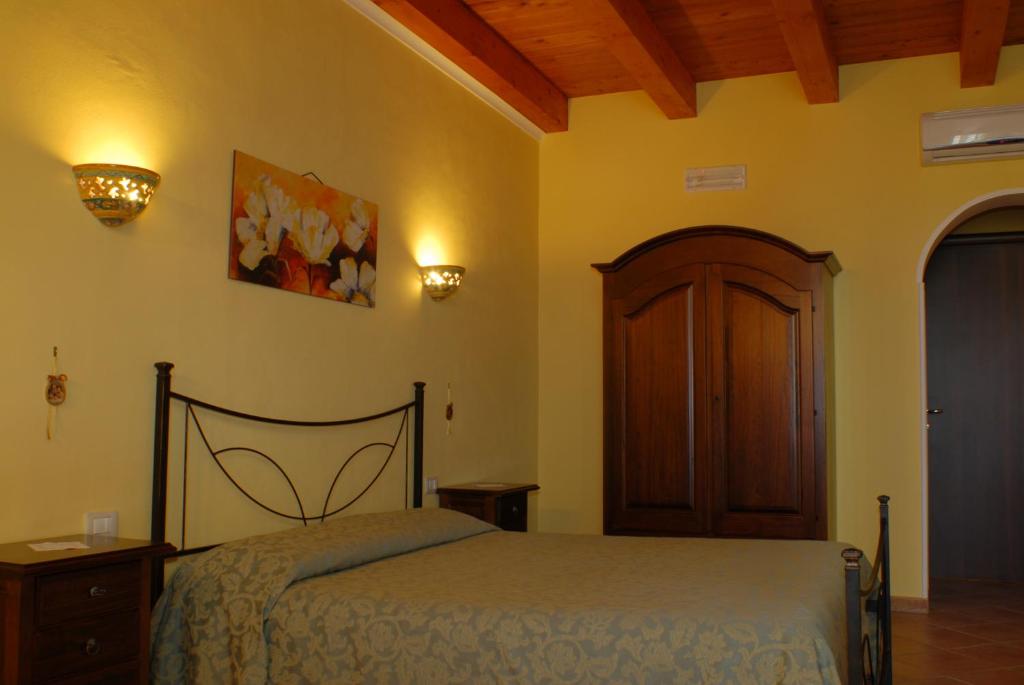 Postel nebo postele na pokoji v ubytování B&B Triskèles