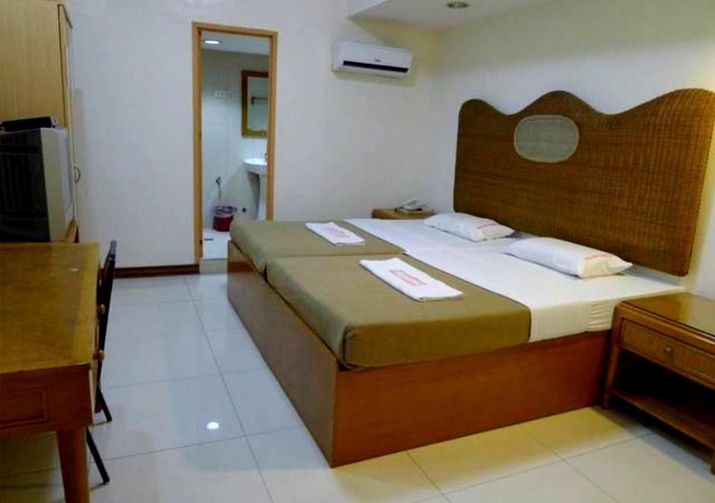 Postel nebo postele na pokoji v ubytování Cebuview Tourist Inn