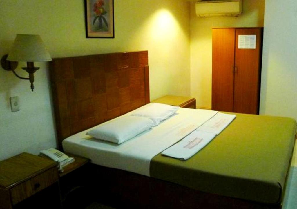 Postel nebo postele na pokoji v ubytování Cebuview Tourist Inn