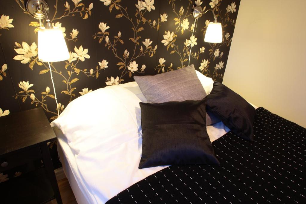 Postel nebo postele na pokoji v ubytování Borgs Villahotell och B&B