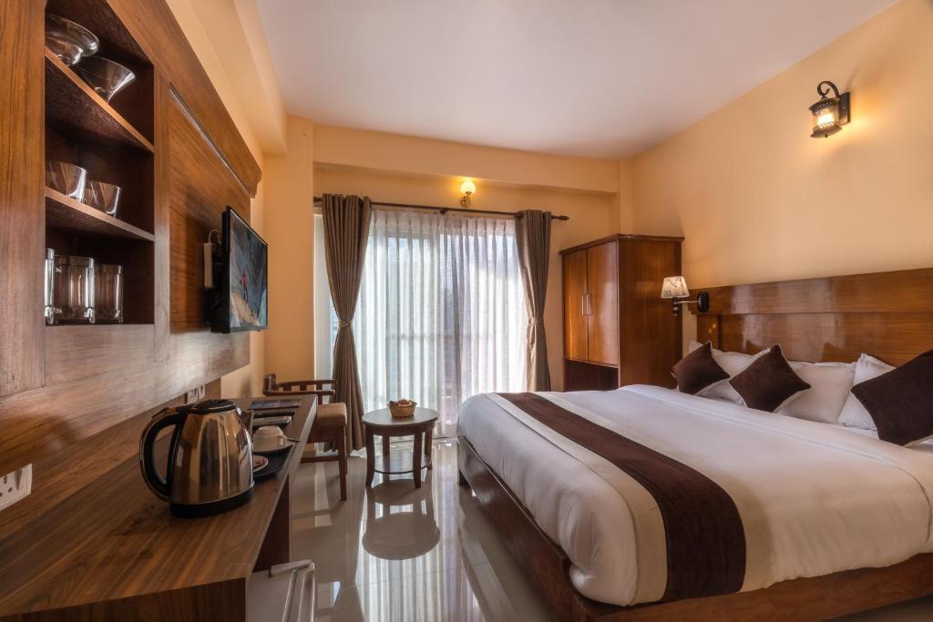 Llit o llits en una habitació de Hotel Lake Shore
