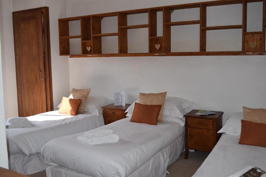 Postel nebo postele na pokoji v ubytování Hotel Sylvana