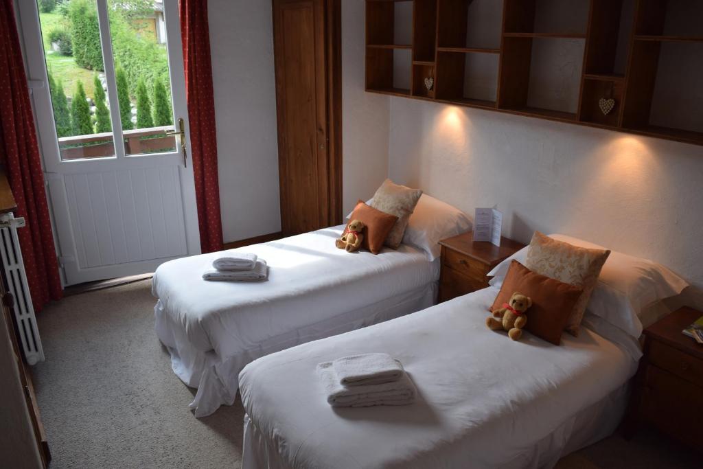 Postel nebo postele na pokoji v ubytování Hotel Sylvana