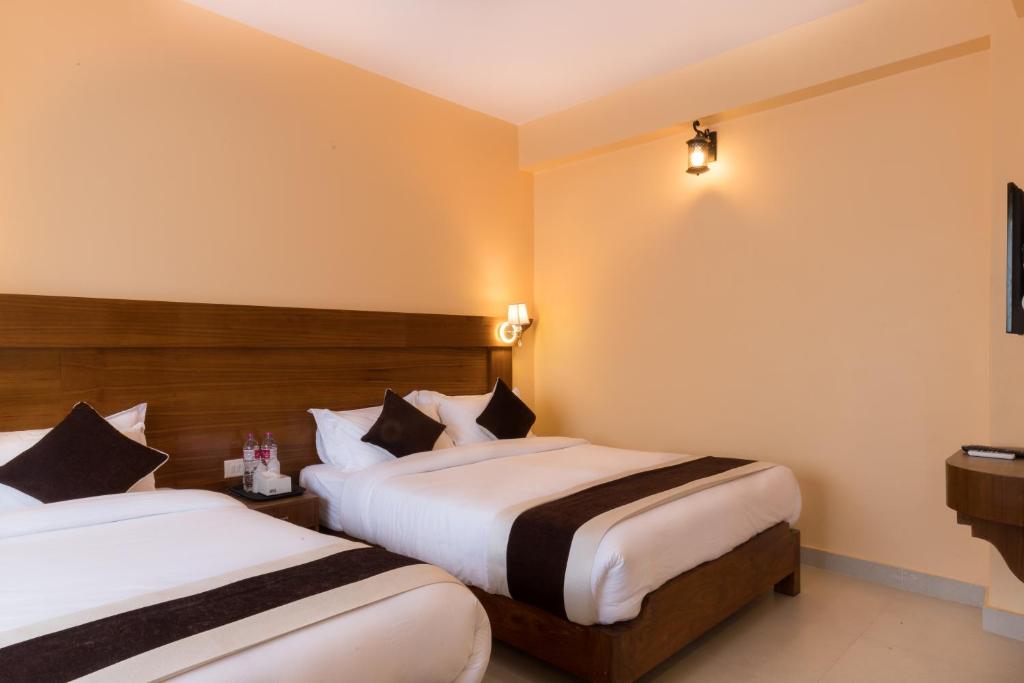 Llit o llits en una habitació de Hotel Lake Shore