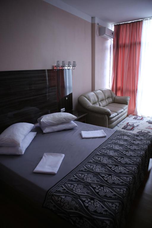 Postel nebo postele na pokoji v ubytování Hotel Borjomi Aisi