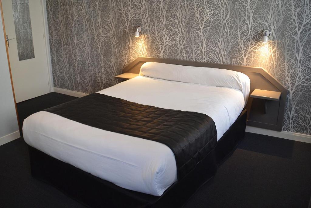 Postel nebo postele na pokoji v ubytování Hotel Angleterre