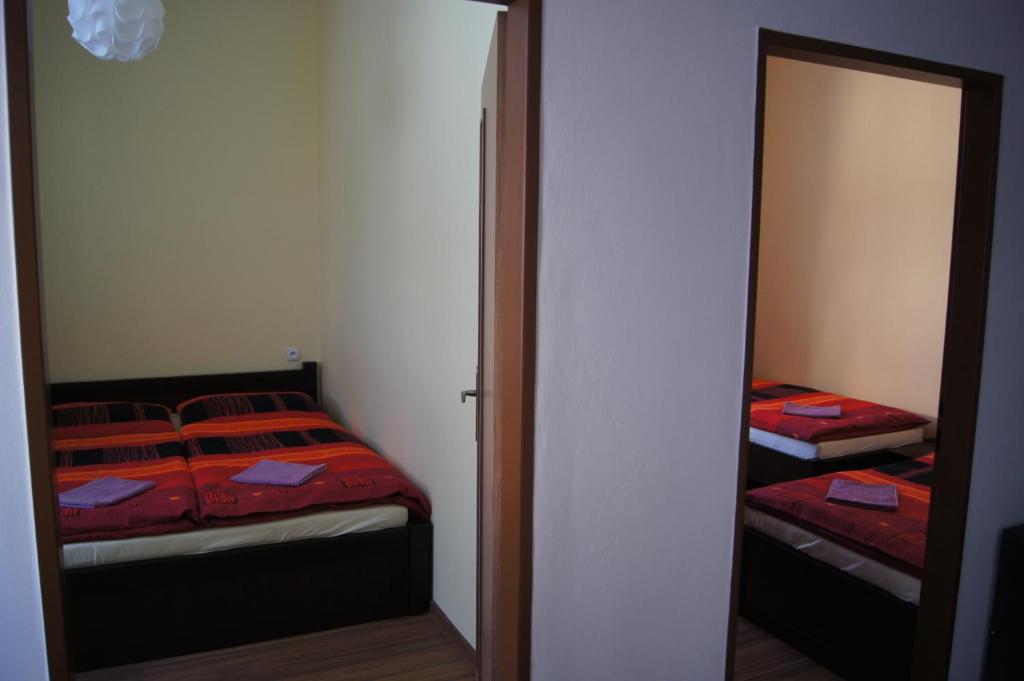 Postel nebo postele na pokoji v ubytování Penzion Modrý Jelen