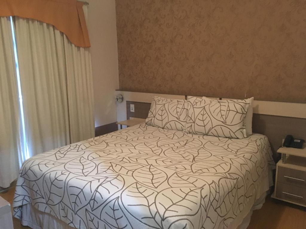 Postel nebo postele na pokoji v ubytování Elite Palace Hotel