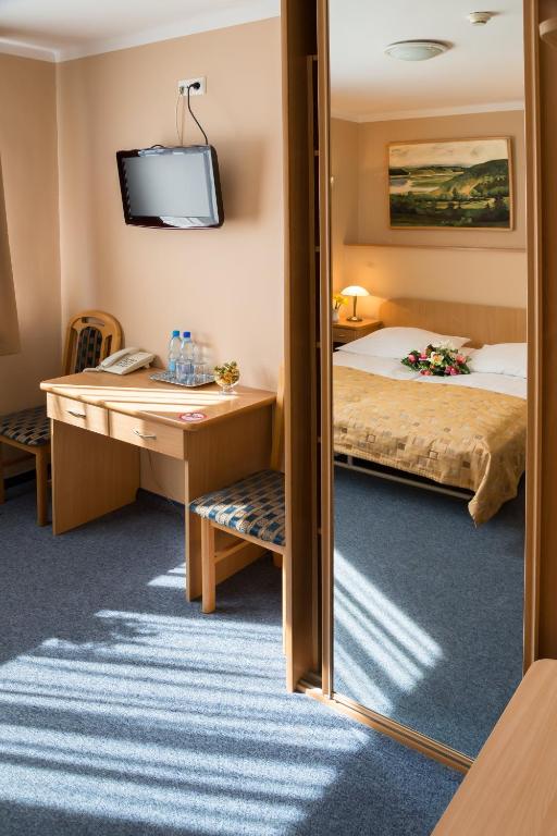 Postel nebo postele na pokoji v ubytování Kompleks Hotelowy Logos