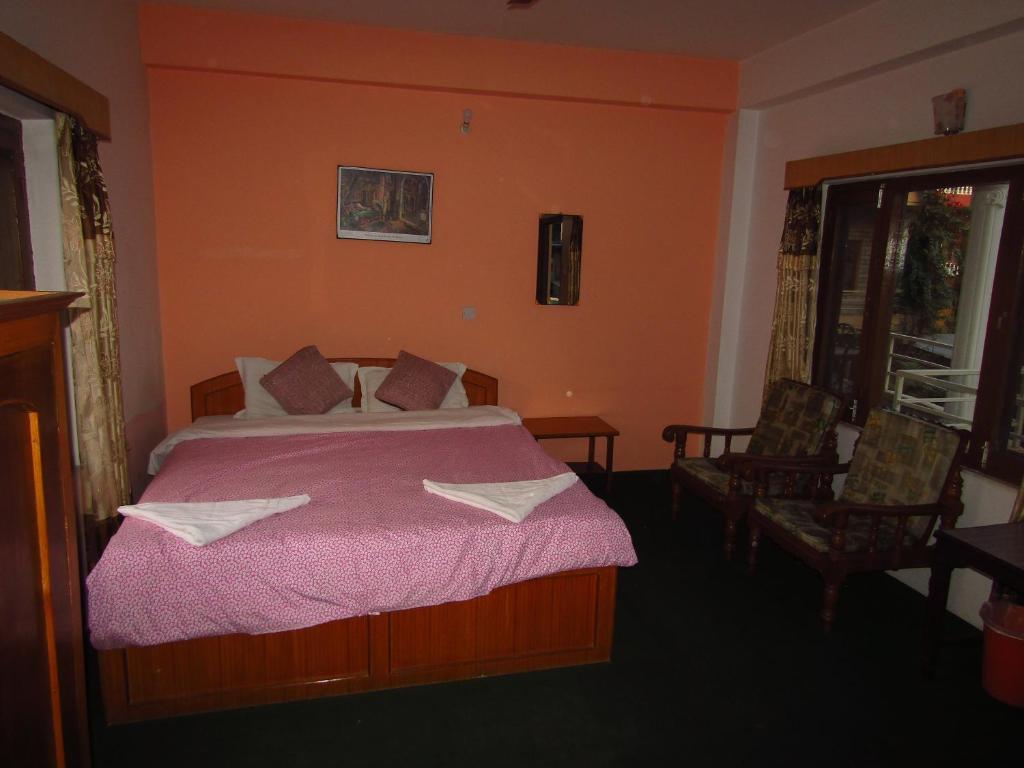 Letto o letti in una camera di Hotel Lotus Inn