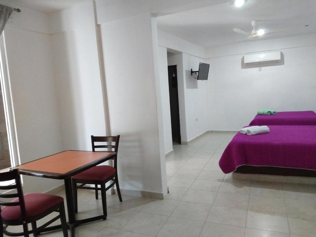 Postel nebo postele na pokoji v ubytování Hotel España