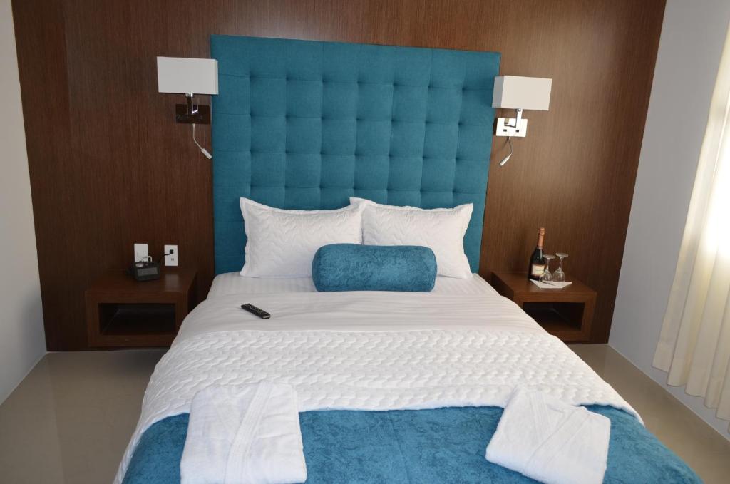 Postel nebo postele na pokoji v ubytování Hotel Gran Mariscal Quito