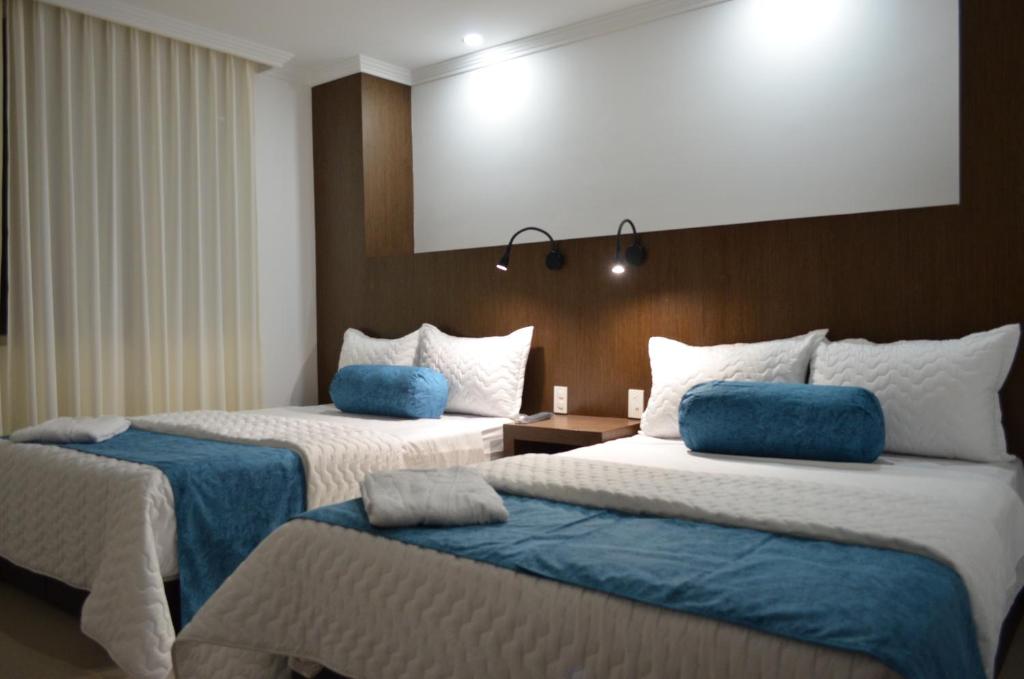 Postel nebo postele na pokoji v ubytování Hotel Gran Mariscal Quito