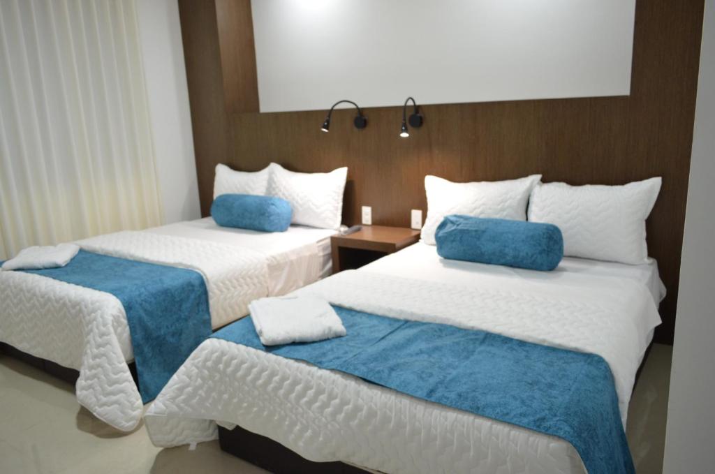 Postel nebo postele na pokoji v ubytování Hotel Gran Mariscal Quito