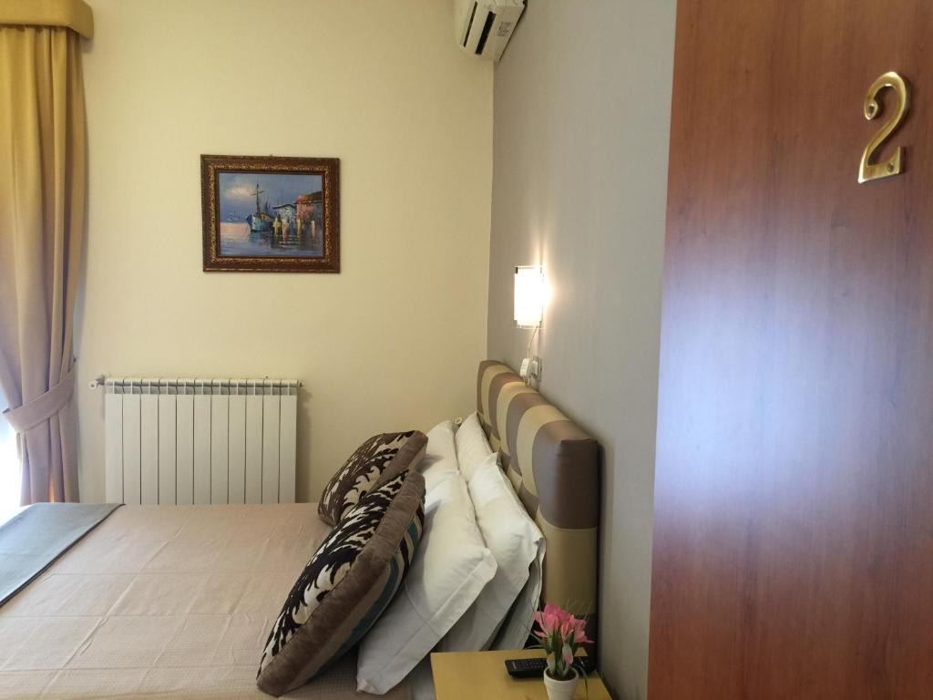 Postel nebo postele na pokoji v ubytování Bed & Breakfast Hostel H24