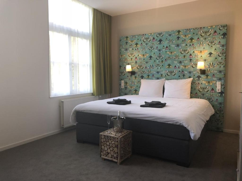 Postel nebo postele na pokoji v ubytování Hotel Hoevevoorde