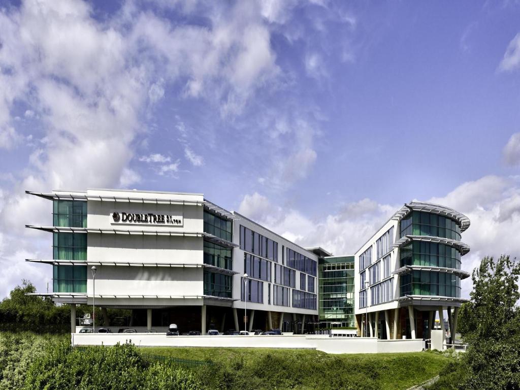 a building with a sign on the side of it at DoubleTree by Hilton Hotel Newcastle International Airport in Newcastle upon Tyne