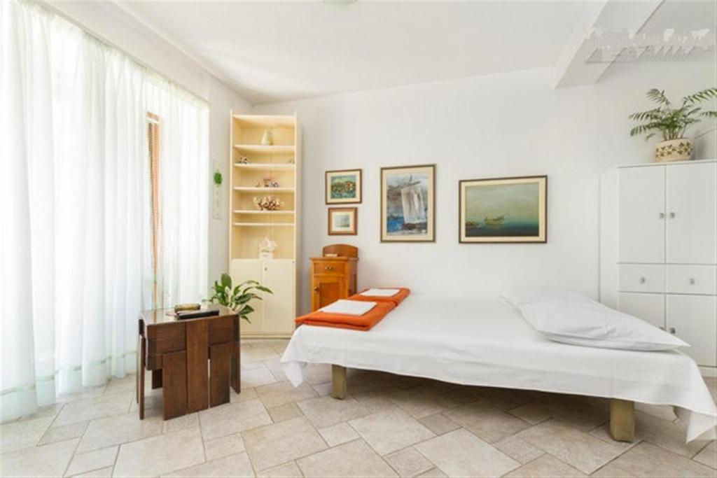 Posteľ alebo postele v izbe v ubytovaní Apartments Varos