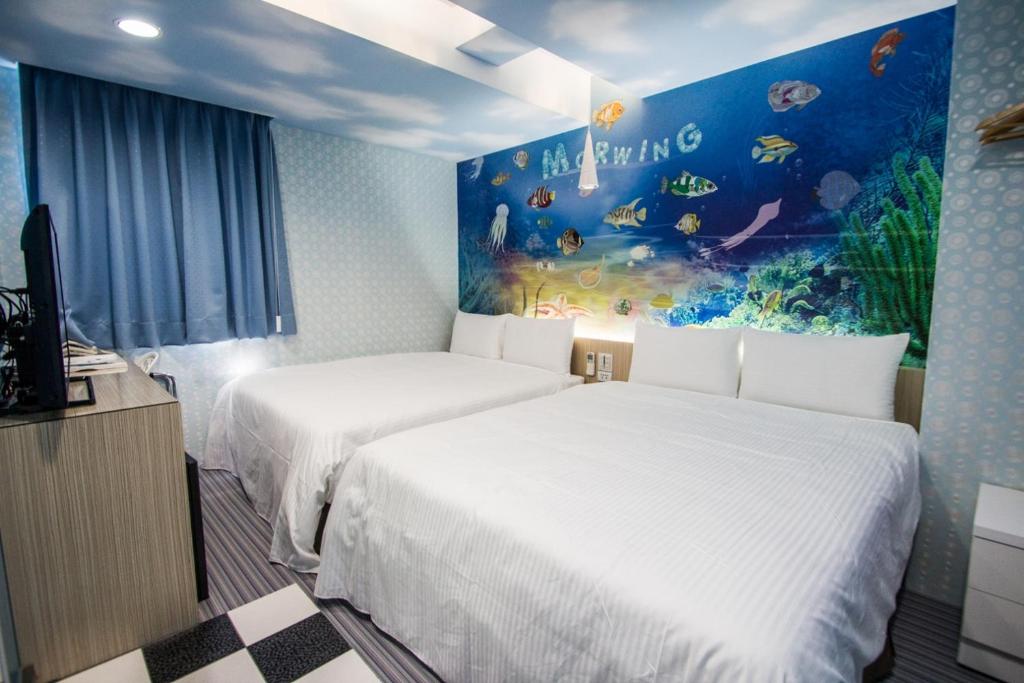 Postel nebo postele na pokoji v ubytování Morwing Hotel - Ocean