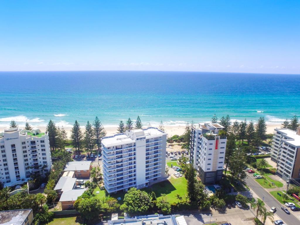 an aerial view of the beach and buildings at Solnamara Beachfront Apartments in Gold Coast