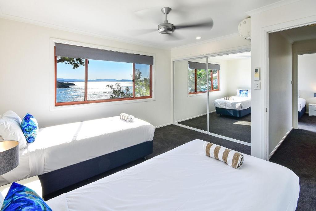 Postel nebo postele na pokoji v ubytování Hamilton Island Holiday Homes