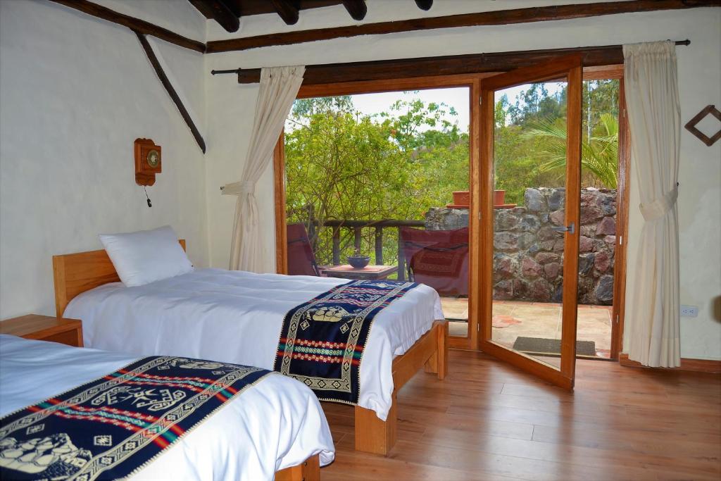 Postel nebo postele na pokoji v ubytování Ilatoa Lodge