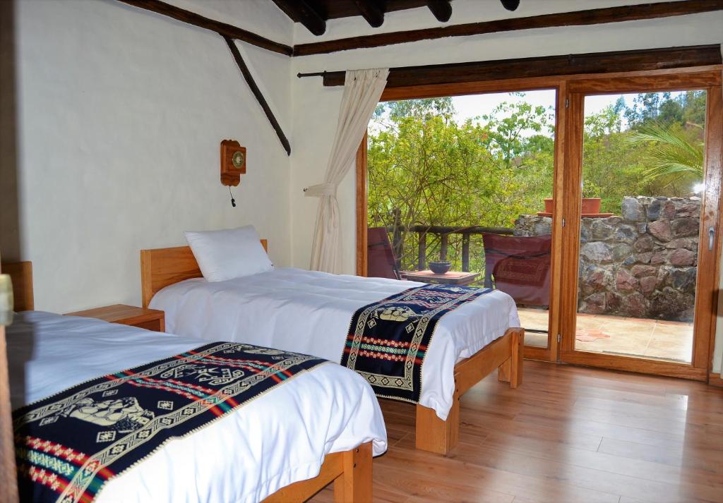 Postel nebo postele na pokoji v ubytování Ilatoa Lodge
