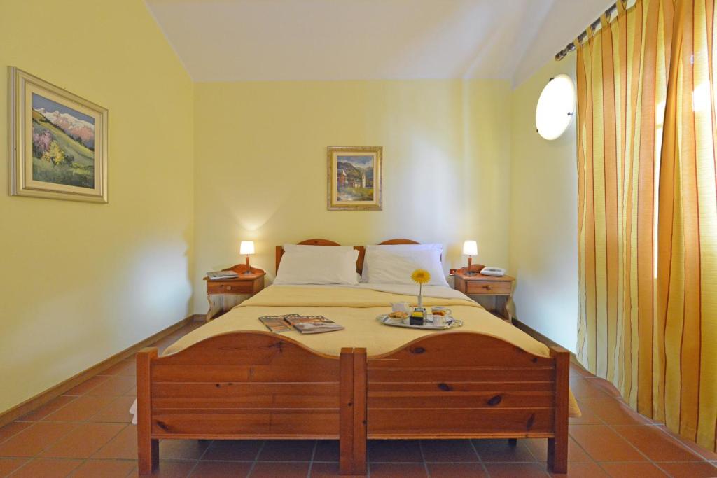 Postel nebo postele na pokoji v ubytování Hotel Maisonnette