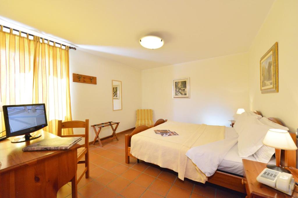 Postel nebo postele na pokoji v ubytování Hotel Maisonnette