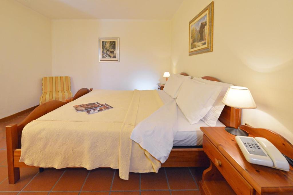 Postel nebo postele na pokoji v ubytování Hotel Maisonnette