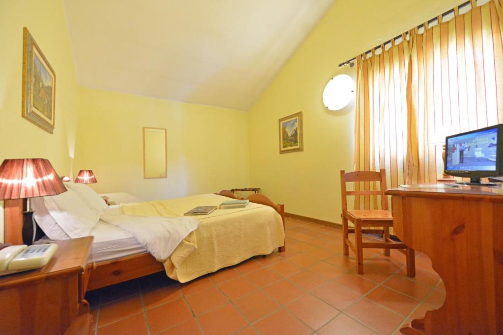 Postel nebo postele na pokoji v ubytování Hotel Maisonnette