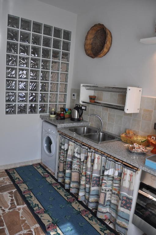 Kuchyň nebo kuchyňský kout v ubytování Pà Blanc B&B