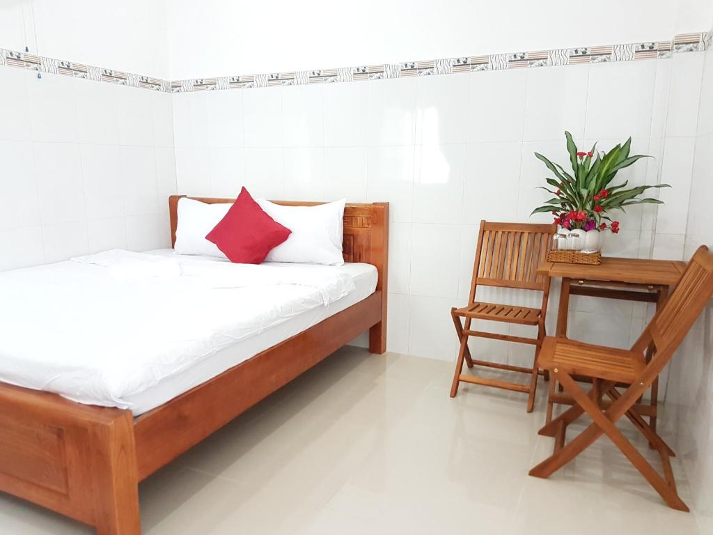 Postel nebo postele na pokoji v ubytování Song Ngoc Guesthouse