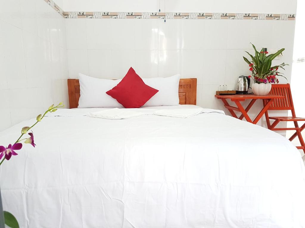 Postel nebo postele na pokoji v ubytování Song Ngoc Guesthouse