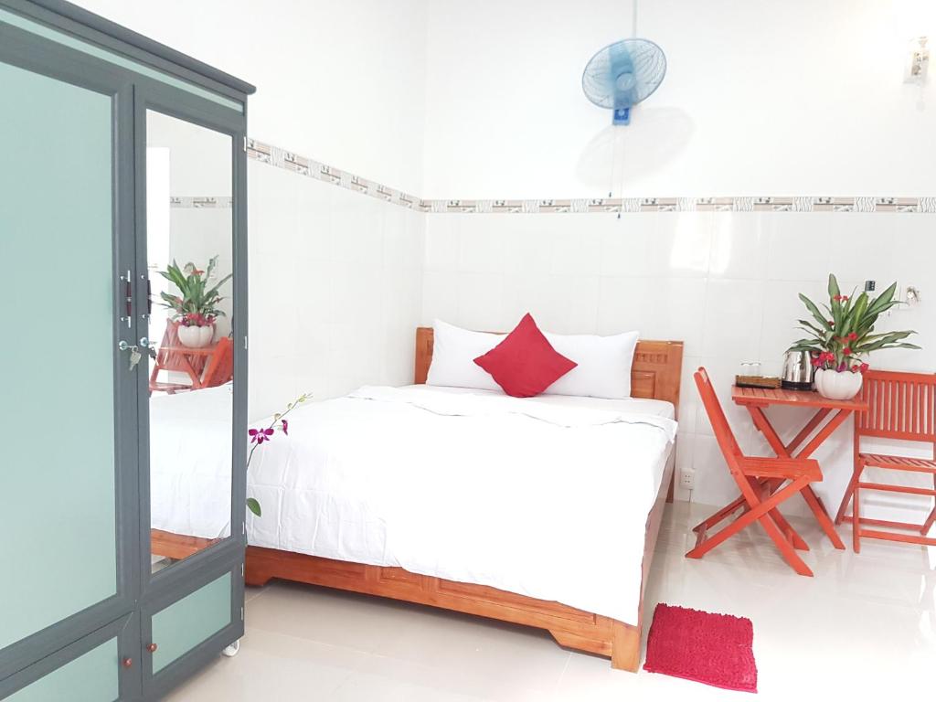 Postel nebo postele na pokoji v ubytování Song Ngoc Guesthouse