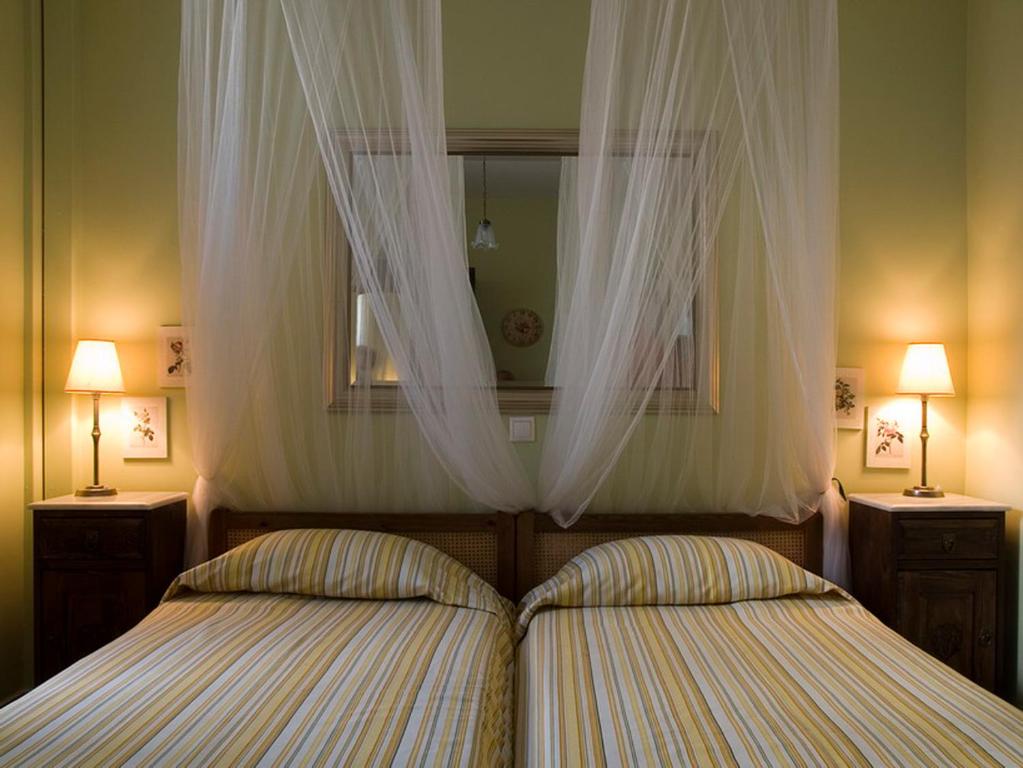 Postel nebo postele na pokoji v ubytování Meliti Guesthouse