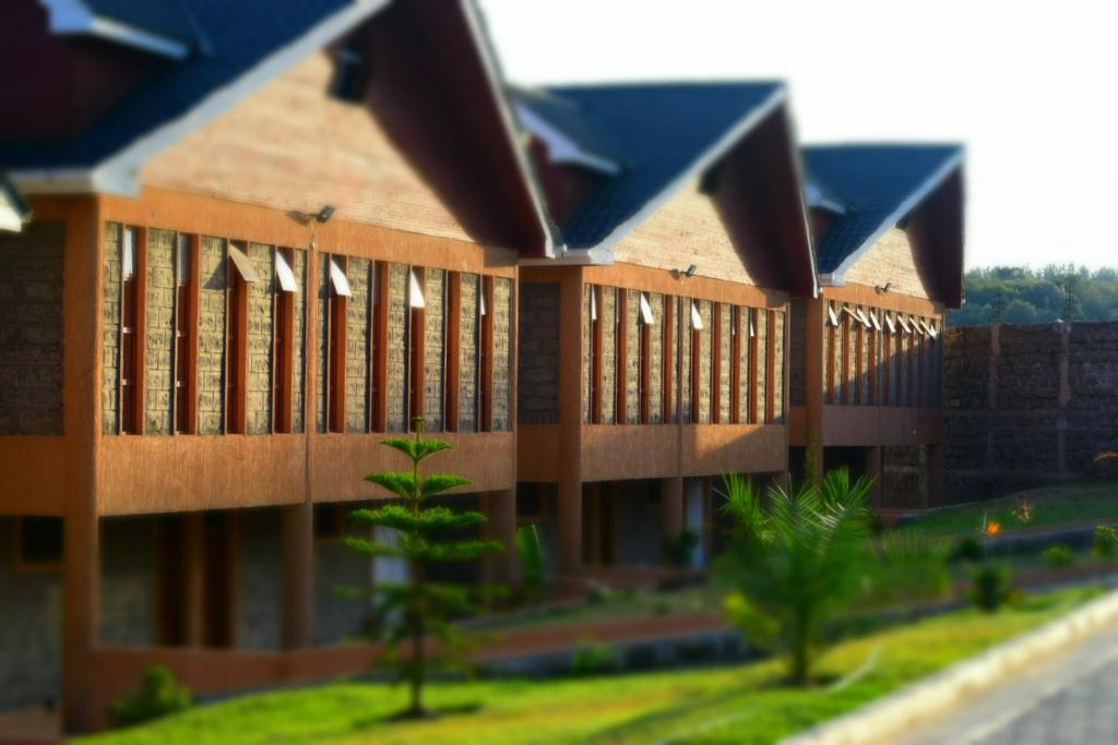 a model of a building with a lot of windows at Esikar Gardens Hotel in Narok