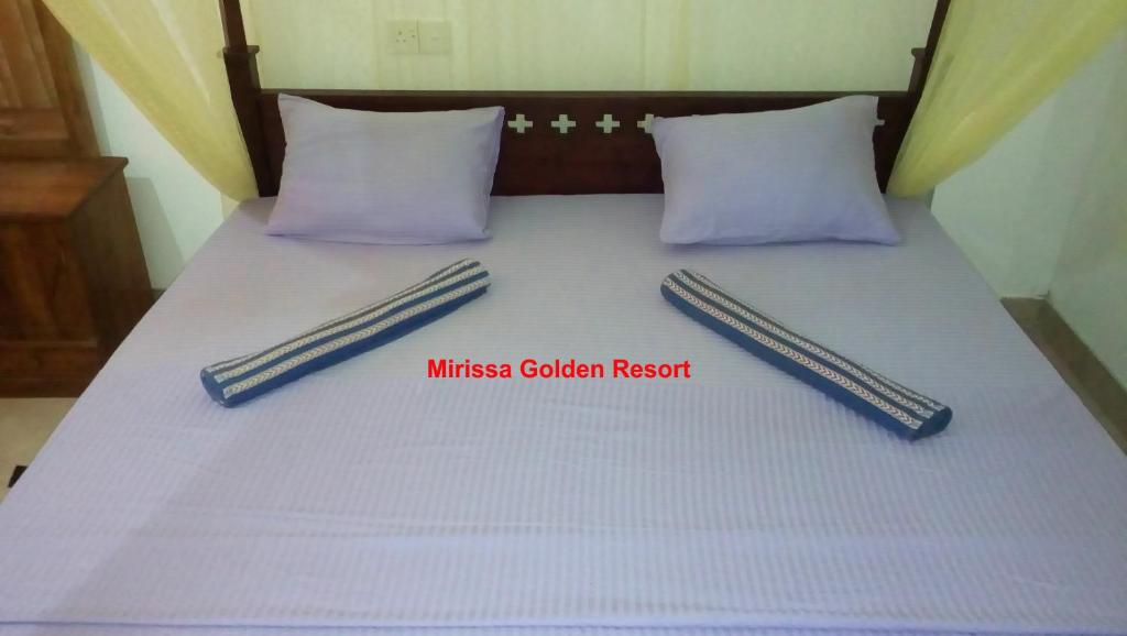 Postel nebo postele na pokoji v ubytování Mirissa Golden Resort