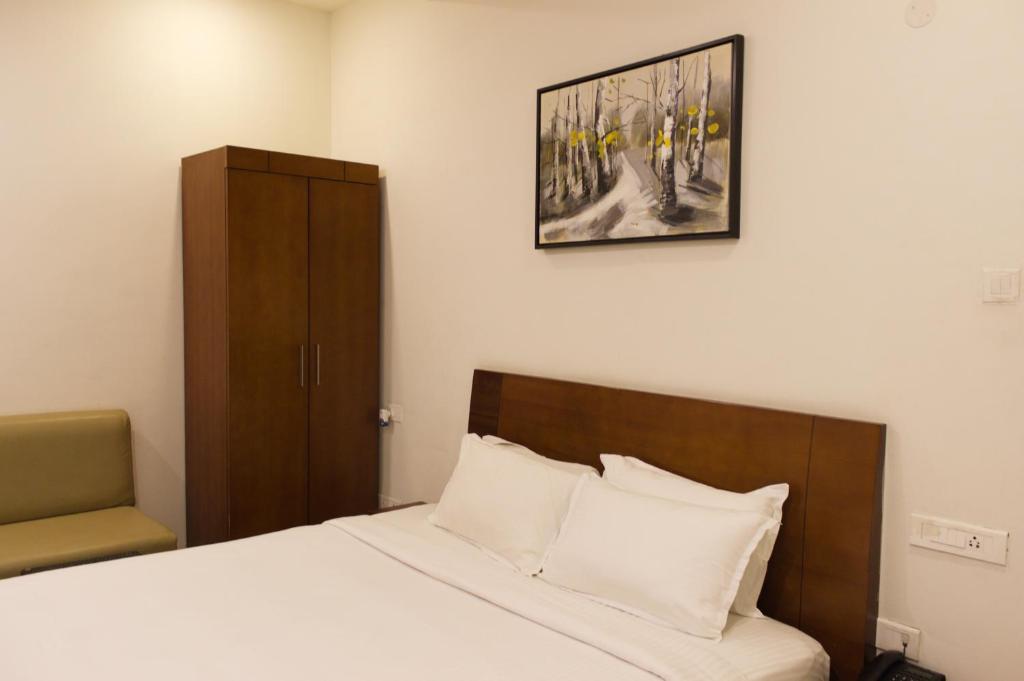 Postel nebo postele na pokoji v ubytování Mrugavani Resort & Spa