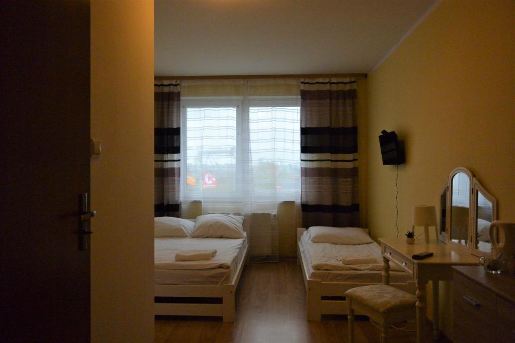 Posteľ alebo postele v izbe v ubytovaní Hostel DV Morski - z prywatnymi łazienkami