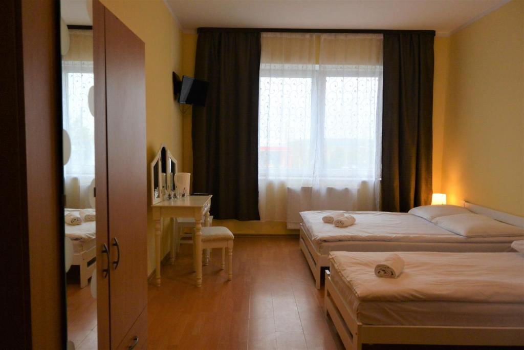 Posteľ alebo postele v izbe v ubytovaní Hostel DV Morski - z prywatnymi łazienkami