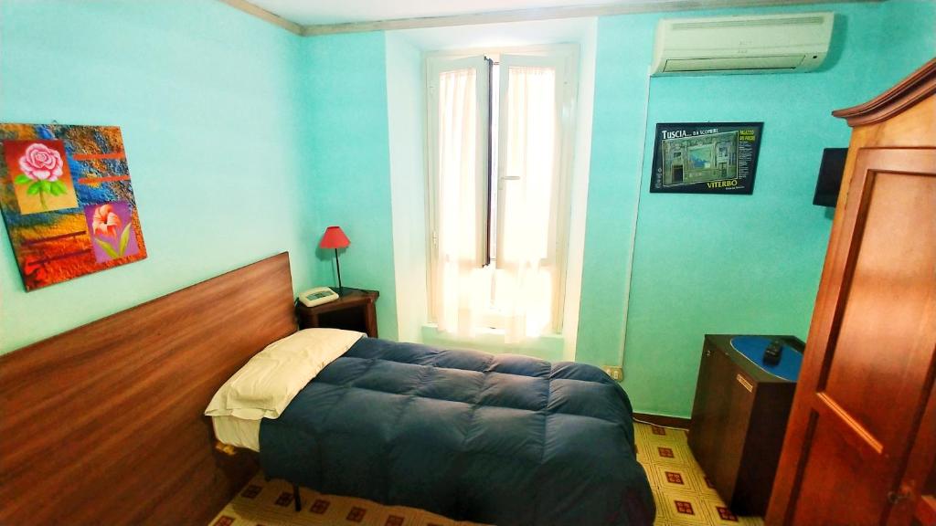 Postel nebo postele na pokoji v ubytování Hotel Centrale