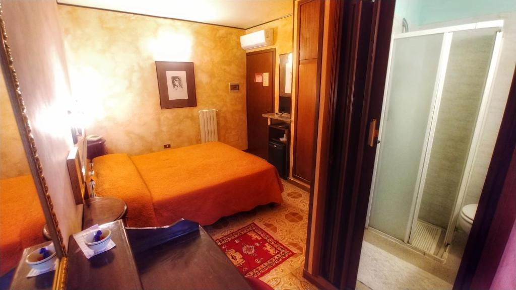 Postel nebo postele na pokoji v ubytování Hotel Centrale
