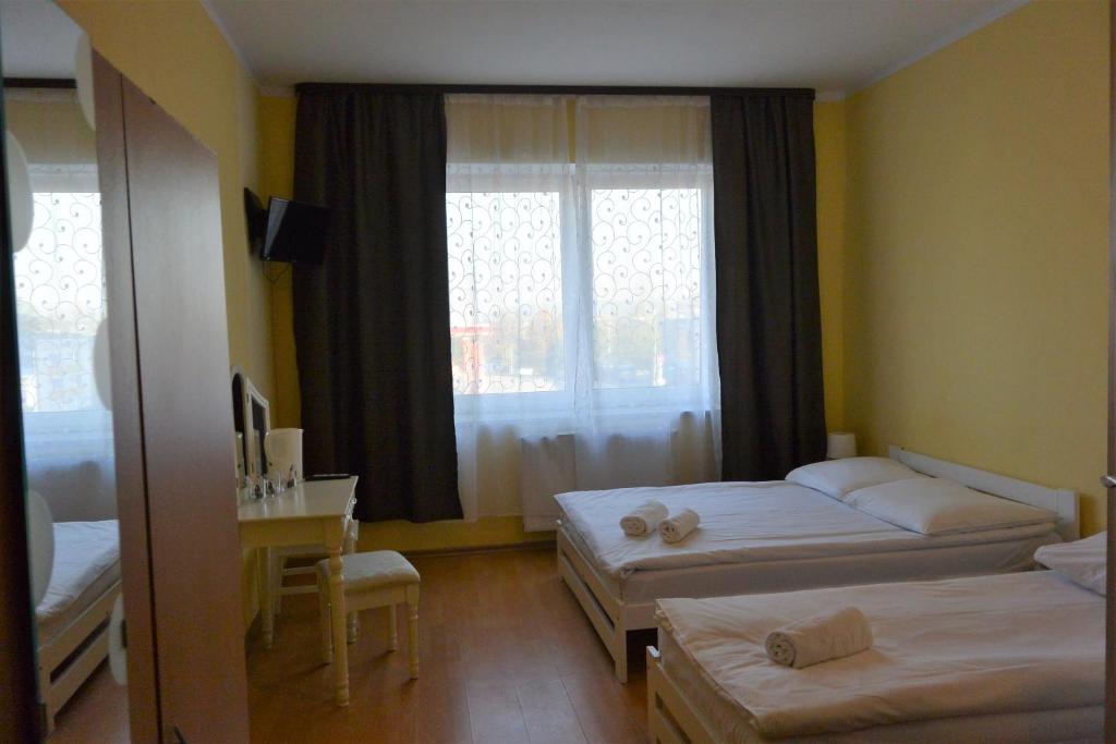Posteľ alebo postele v izbe v ubytovaní Hostel DV Morski - z prywatnymi łazienkami