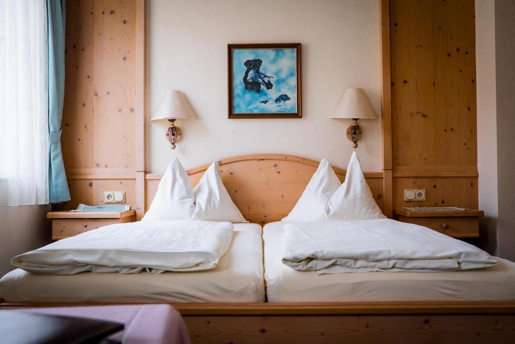 Postel nebo postele na pokoji v ubytování Hotel Krug