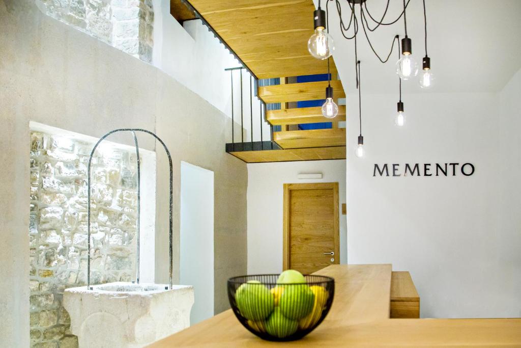 a bowl of tennis balls on a table in a room at MEMENTO B&B Piran in Piran