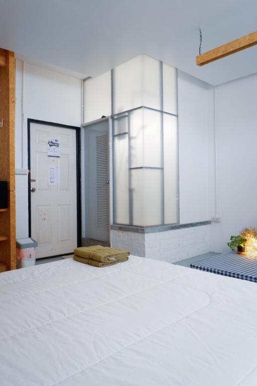 Postel nebo postele na pokoji v ubytování Hugger Hostel
