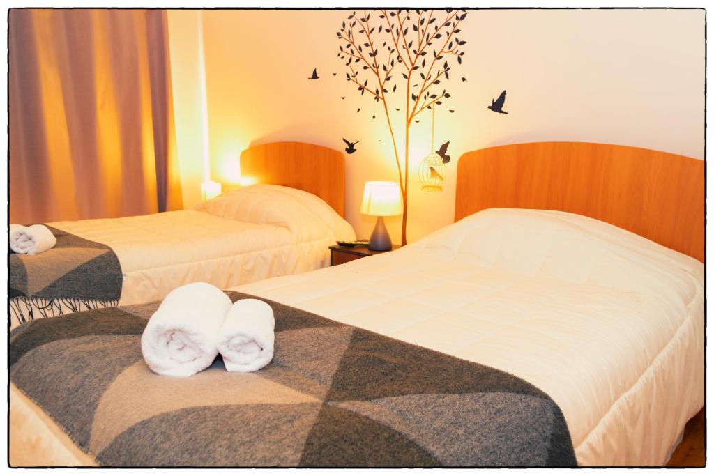 Postel nebo postele na pokoji v ubytování Hostal Los Teros
