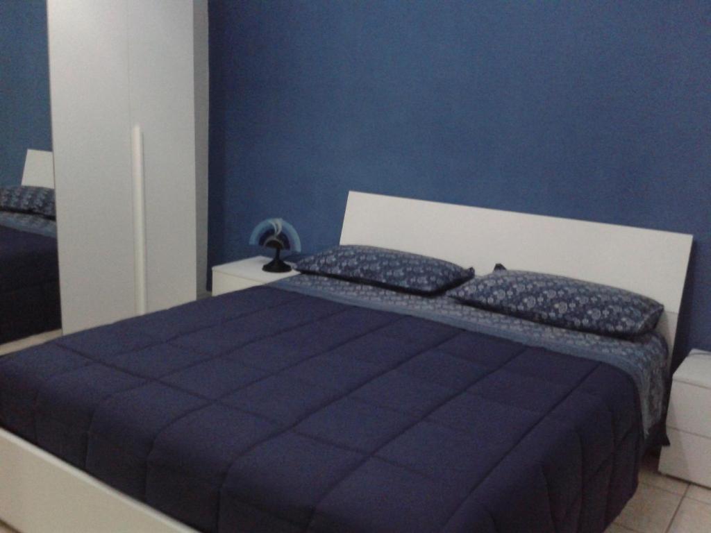 Ein Bett oder Betten in einem Zimmer der Unterkunft Catania House